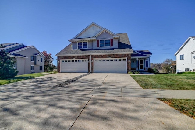 view of front of home featuring a front yard and a garage