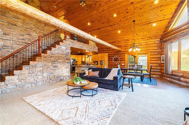 living room with wood ceiling, high vaulted ceiling, carpet floors, and rustic walls