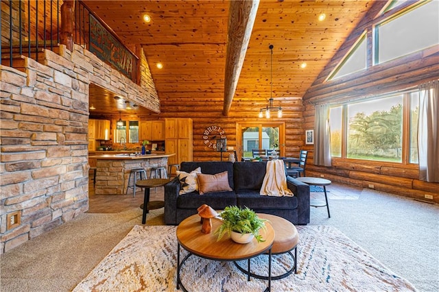 carpeted living room with a healthy amount of sunlight, log walls, and high vaulted ceiling