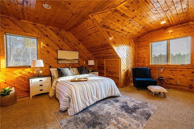 bedroom with multiple windows, wood walls, and wooden ceiling