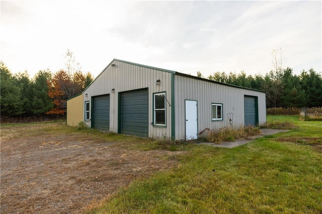 garage with a lawn