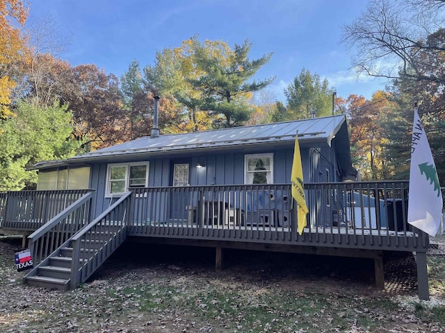 back of house with a wooden deck