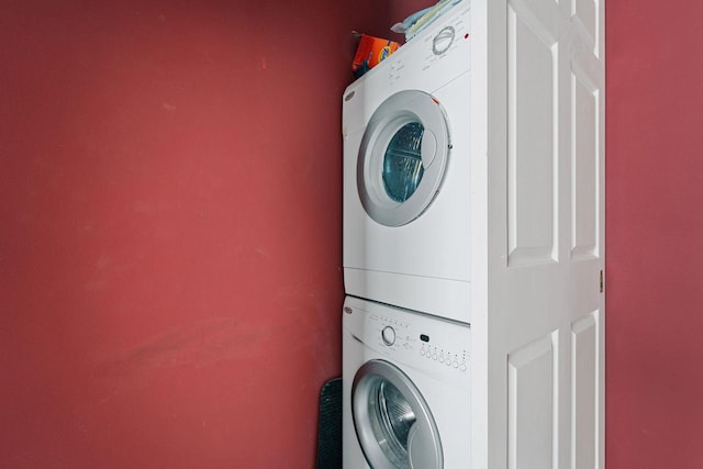 laundry area with stacked washer / drying machine