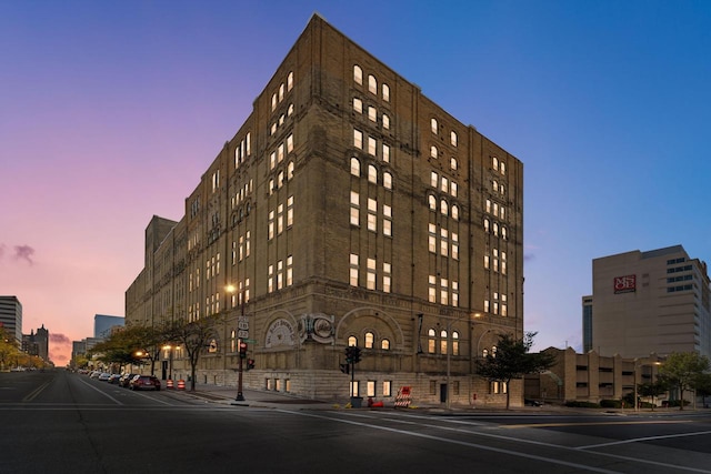 view of outdoor building at dusk