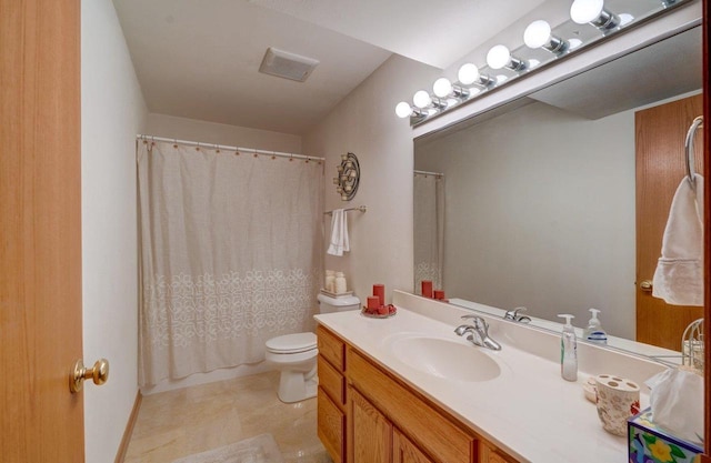 bathroom with vanity, toilet, and walk in shower