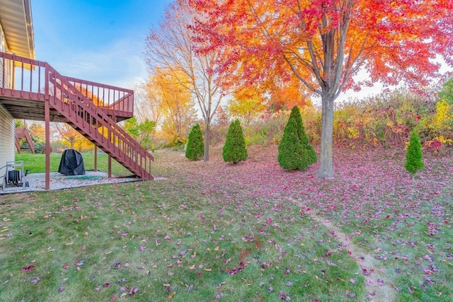 view of yard featuring a wooden deck