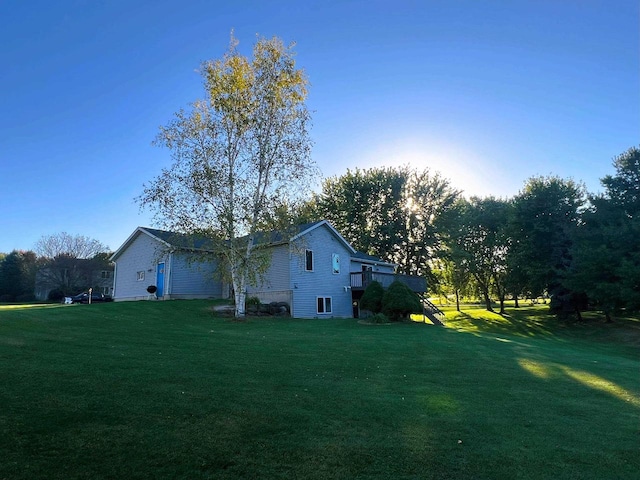 view of property exterior with a yard