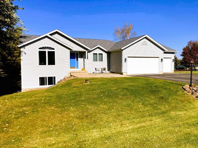 6848 Moonlight Cir, Sun Prairie, WI 53590 - ranch-style home with an attached garage, asphalt driveway, a front lawn, and a shingled roof