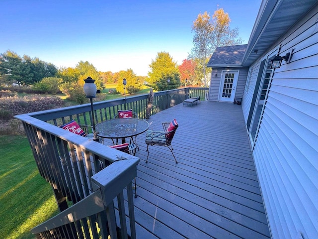 6848 Moonlight Cir, Sun Prairie, WI 53590 - wooden deck with outdoor dining area and a lawn