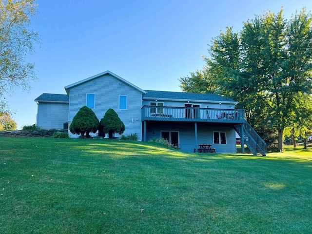 6848 Moonlight Cir, Sun Prairie, WI 53590 - back of house with stairway, a deck, and a lawn