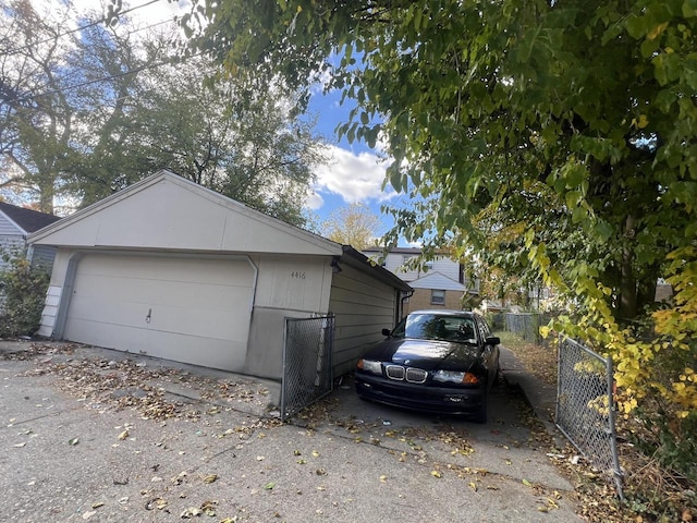 view of home's exterior with an outdoor structure and a garage