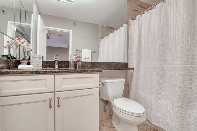 bathroom with vanity, a shower with shower curtain, a textured ceiling, and toilet