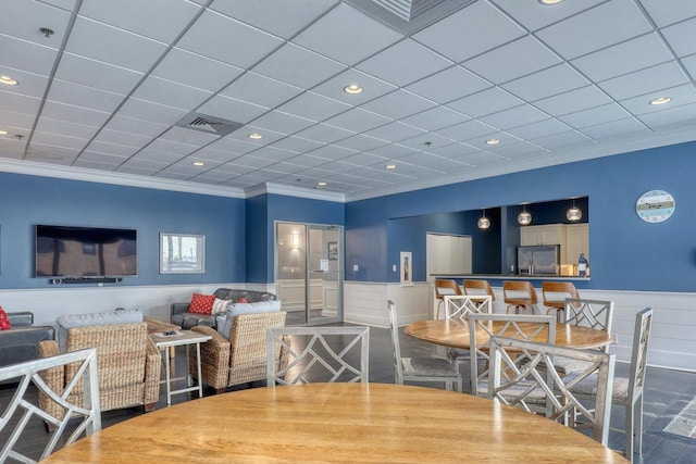 dining area with ornamental molding