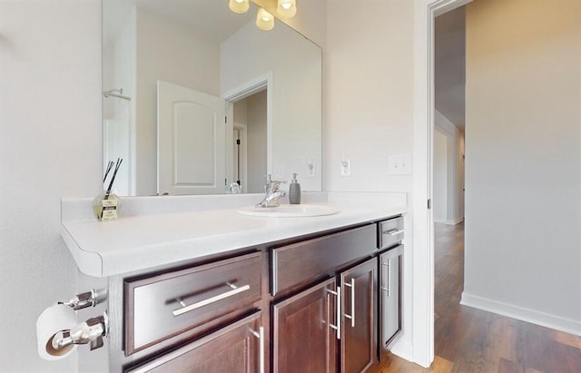 bathroom with vanity and wood-type flooring