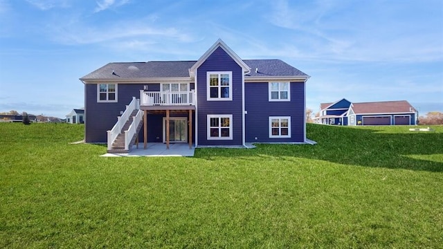 back of house featuring a patio and a lawn