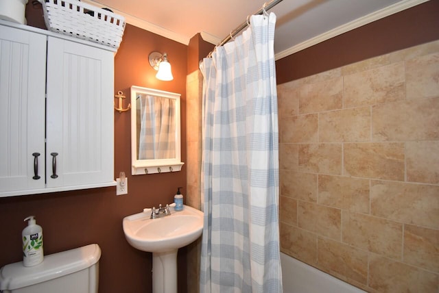 bathroom featuring shower / bath combination with curtain, toilet, and crown molding