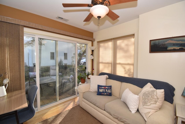 sunroom / solarium with ceiling fan