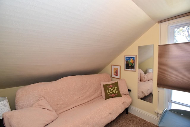 living area with vaulted ceiling and carpet floors