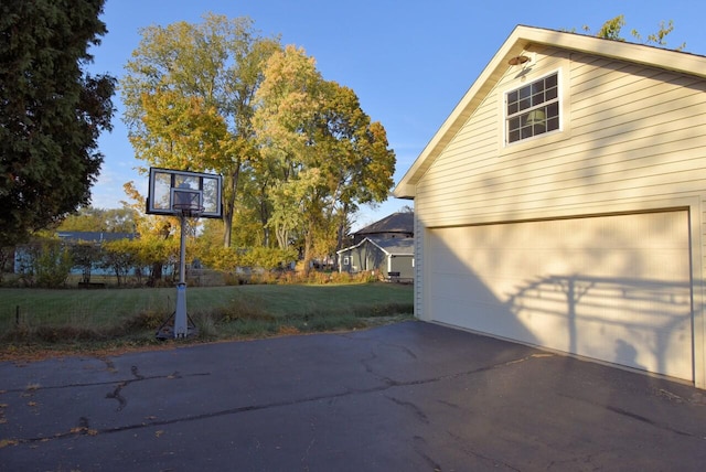 view of home's exterior with a yard and a garage