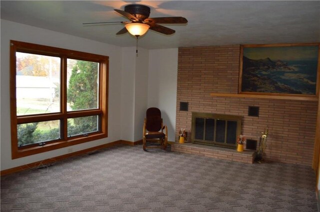 unfurnished living room with a fireplace, carpet floors, and ceiling fan