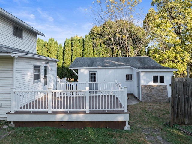 back of house featuring a wooden deck