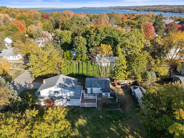 birds eye view of property featuring a water view and a forest view