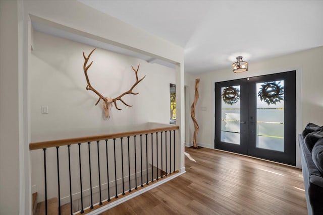 foyer featuring french doors and hardwood / wood-style floors