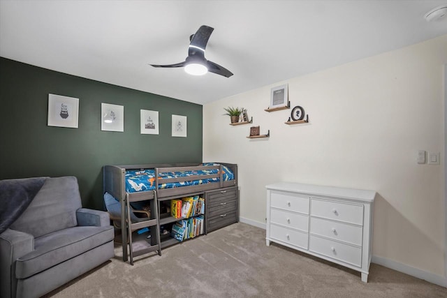 bedroom featuring ceiling fan and light colored carpet