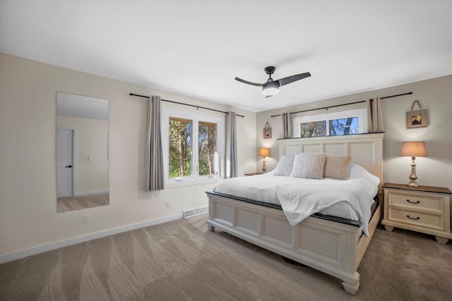 carpeted bedroom with ceiling fan