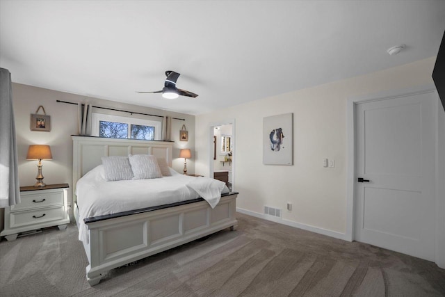 carpeted bedroom featuring connected bathroom and ceiling fan