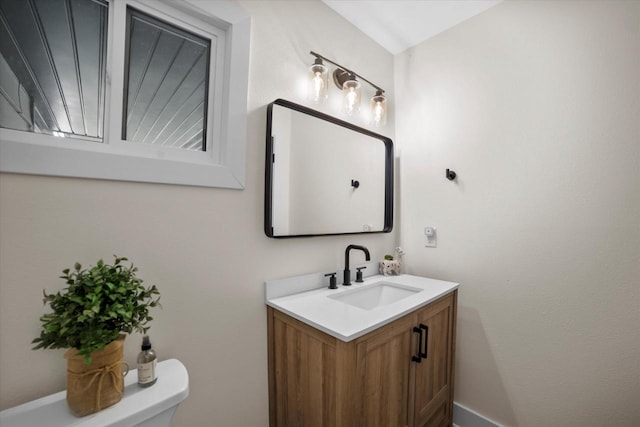 bathroom with vanity and toilet