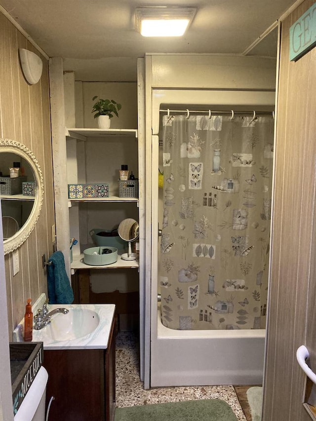 bathroom with vanity and shower / tub combo