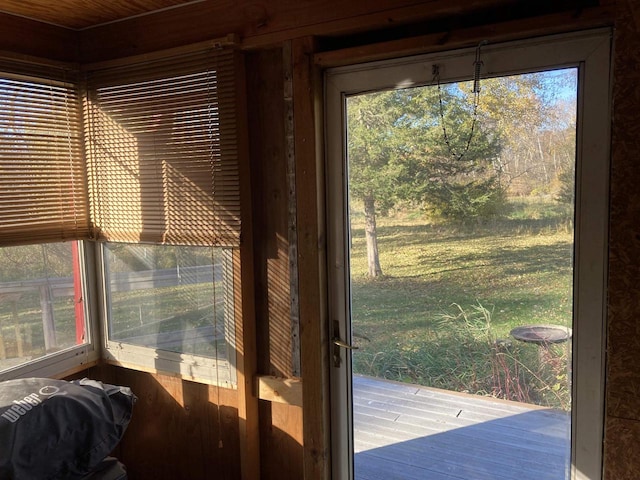 entryway with wooden walls