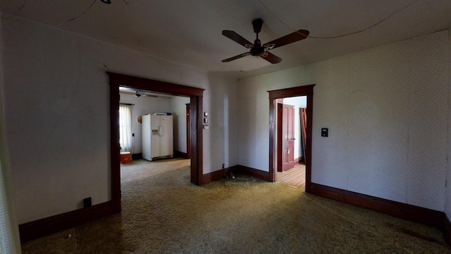 carpeted empty room with ceiling fan