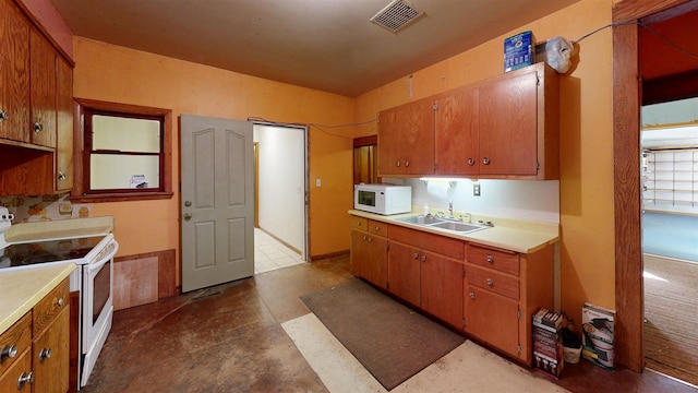 kitchen featuring sink and white appliances