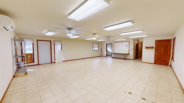 unfurnished room featuring a wall mounted air conditioner and ceiling fan