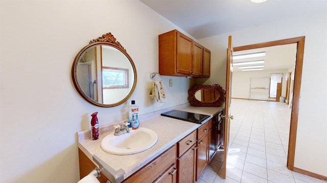 interior space with vanity and tile patterned floors