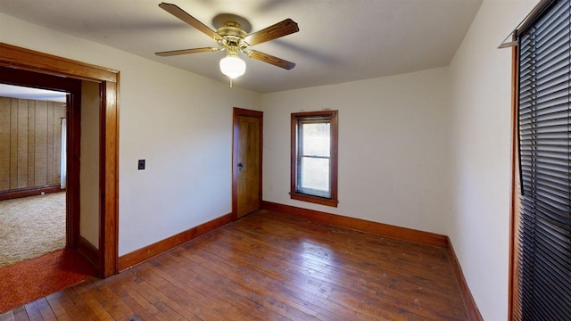 unfurnished bedroom featuring dark hardwood / wood-style flooring and ceiling fan