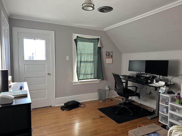 home office with light hardwood / wood-style flooring, crown molding, and vaulted ceiling