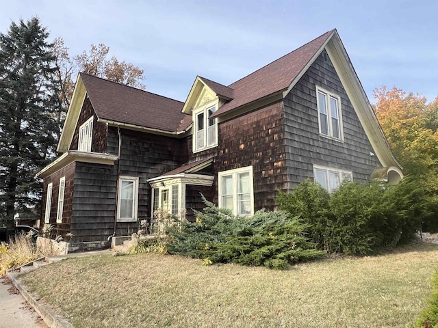 view of home's exterior with a yard