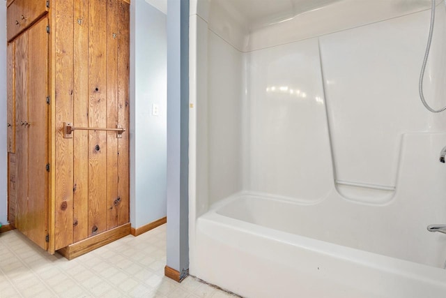 bathroom with shower / washtub combination