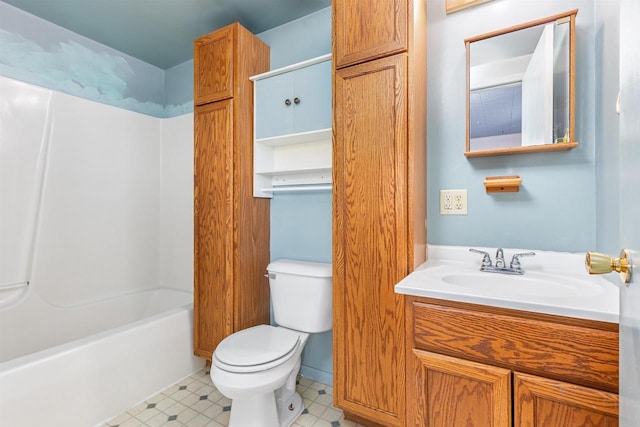 full bathroom with toilet, vanity, and washtub / shower combination