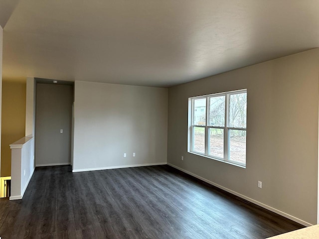 empty room featuring dark hardwood / wood-style floors