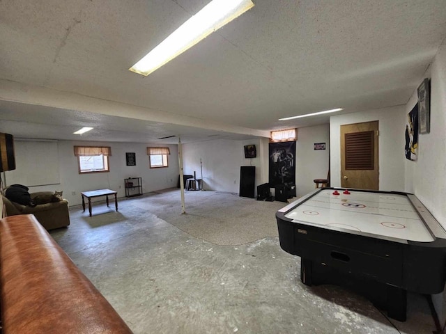 game room featuring unfinished concrete flooring