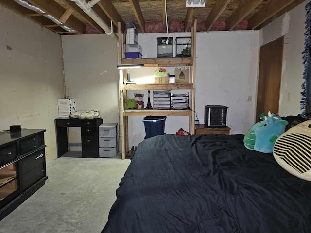 bedroom featuring concrete flooring