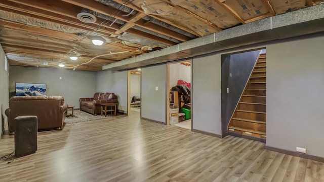 basement featuring hardwood / wood-style flooring