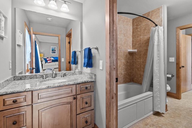 full bathroom with vanity, toilet, tile patterned floors, and shower / bath combo