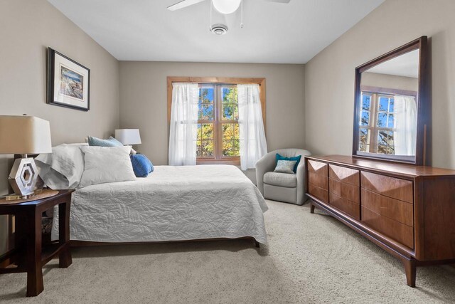 carpeted bedroom with ceiling fan