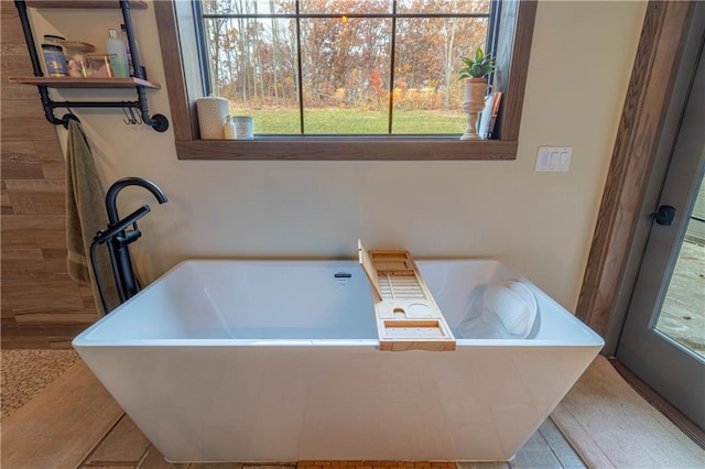 bathroom featuring a tub to relax in