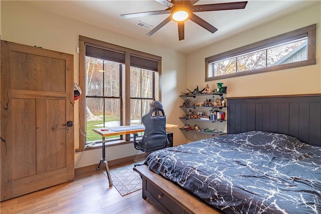 bedroom featuring light hardwood / wood-style floors and ceiling fan